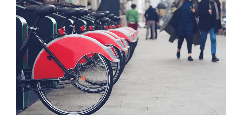 A delivery rider checking a location-tracking app